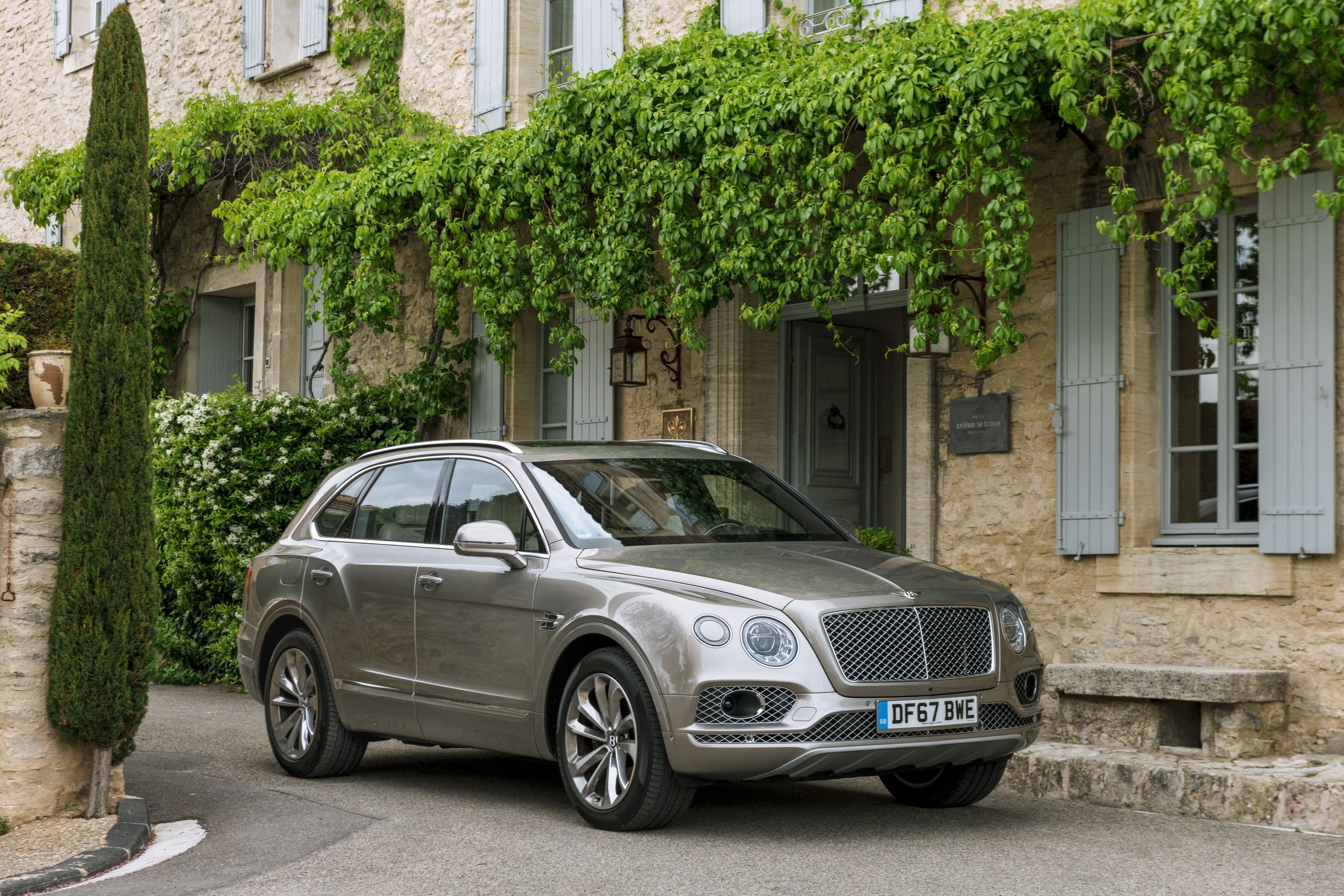 Commercial automotive photography of a Bentley Bentayga and cyclist Adrian Timmis by photographer Michael Schauer for Bentley Motors in the Provence region of south France