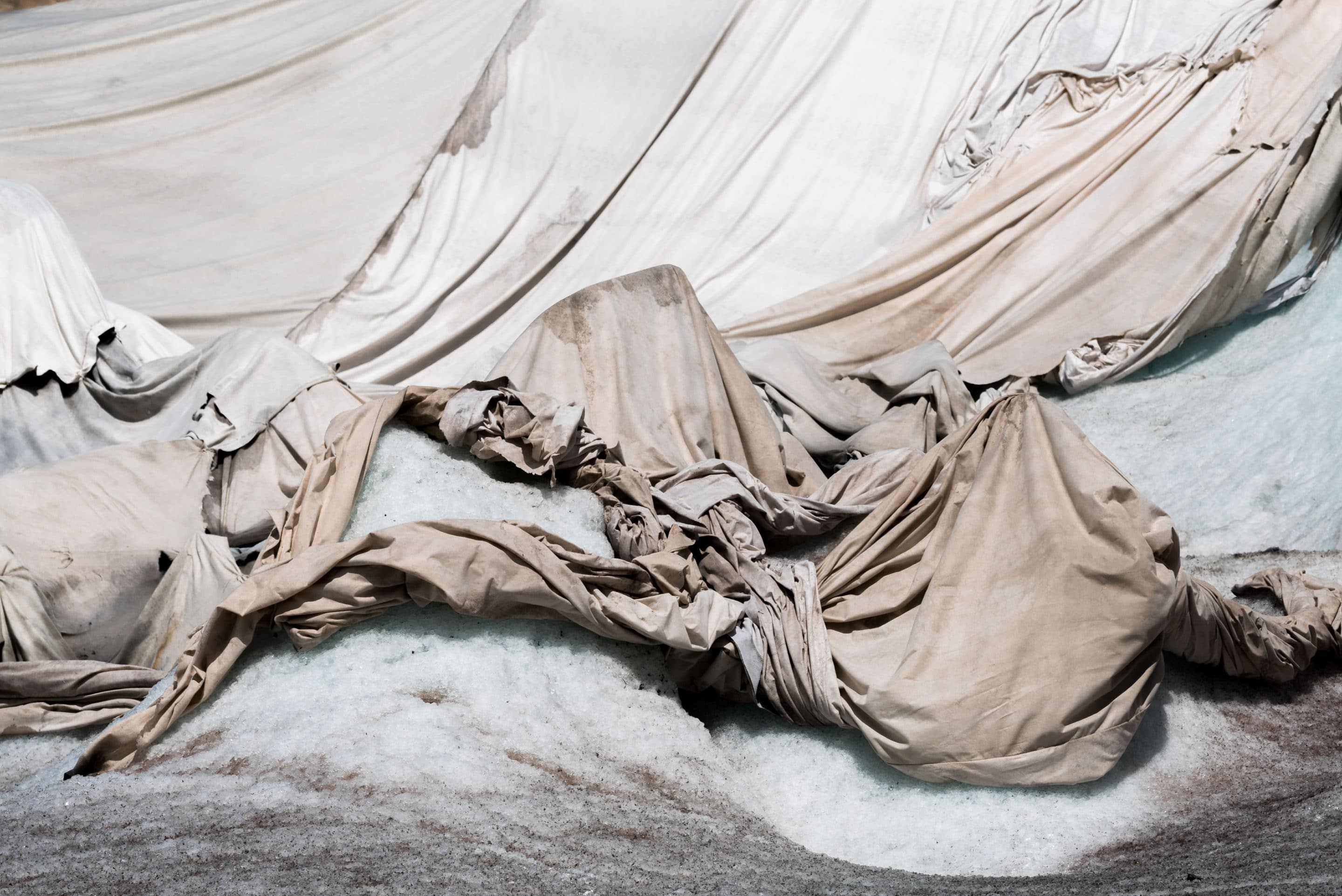 Fine art photographer Michael Schauer shoots the abstract landscape of Shrouds over a glacier in Switzerland to protect it from the sun in summer. This is but one example for how humans are finding solutions for dealing with man made climate change