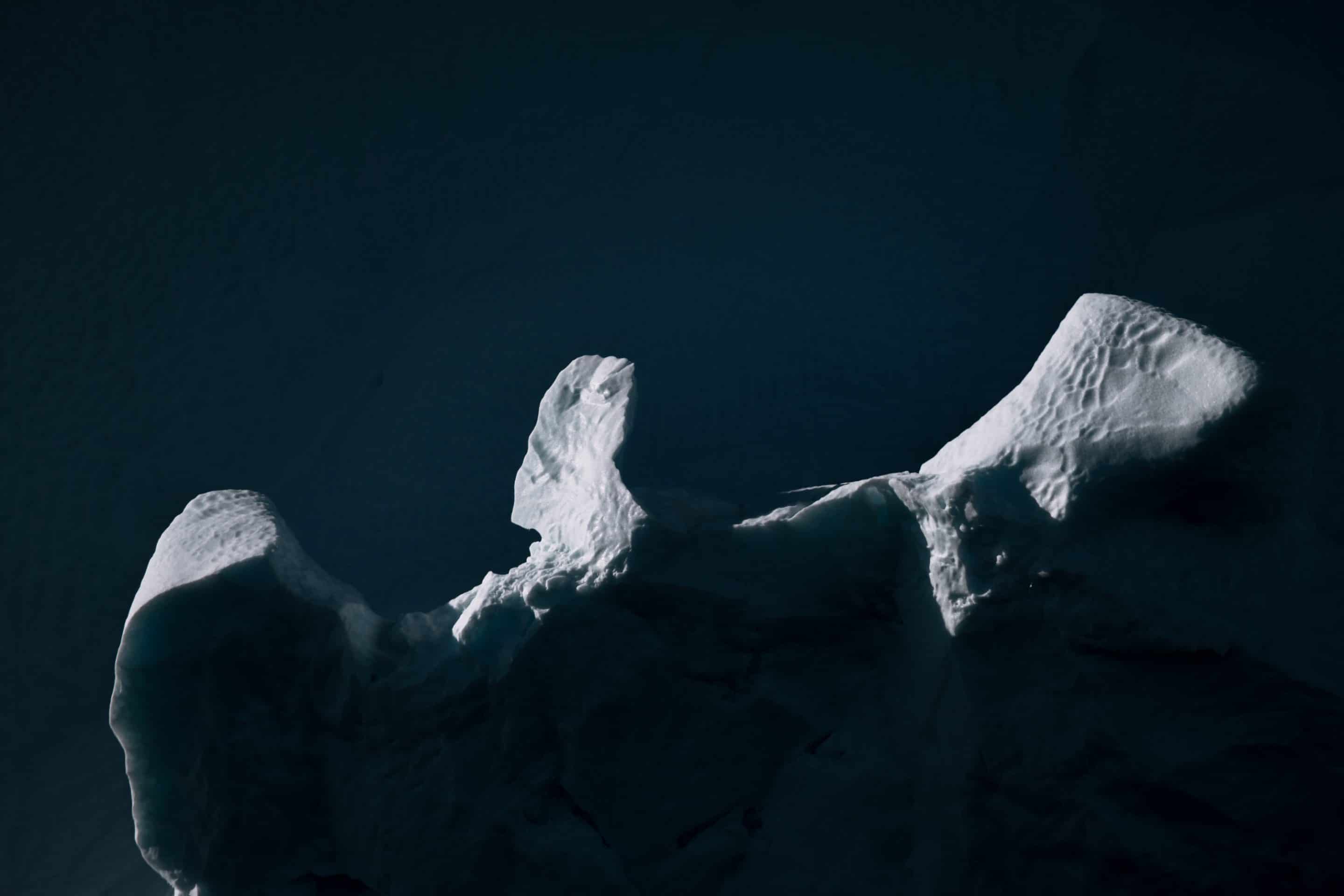 The endlessly complex landscape of abstract shapes and forms of icebergs in the Atlantic ocean at the west Greenland coast by Fine Art photographer Michael Schauer