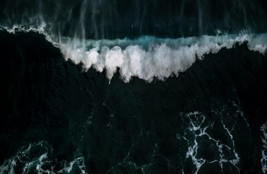 Drone image of crashing waves during sunset out on the Atlantic near Madeira island, Portugal by photographer Michael Schauer