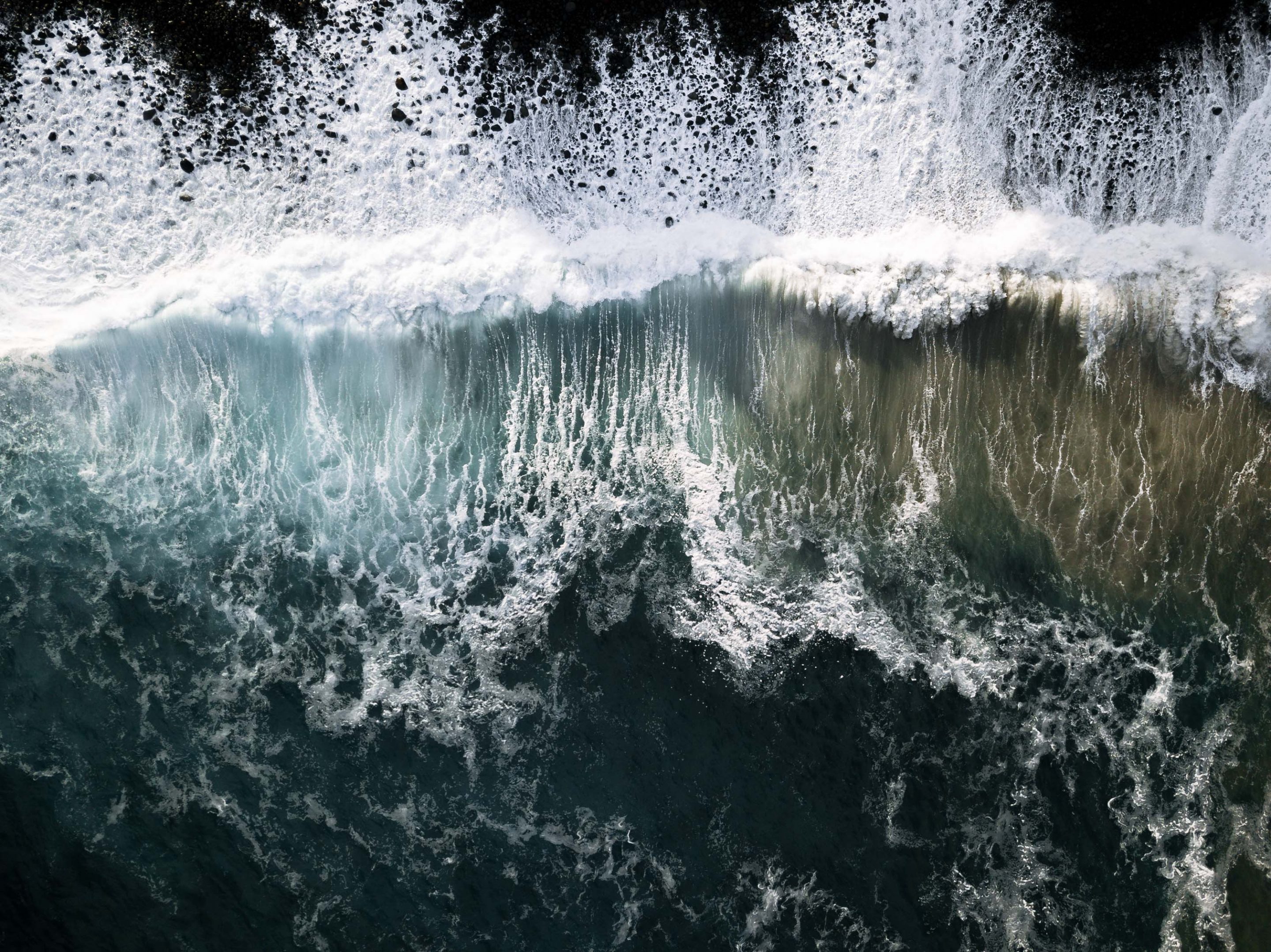 Drone image of crashing waves during sunset out on the Atlantic near Madeira island, Portugal by photographer Michael Schauer